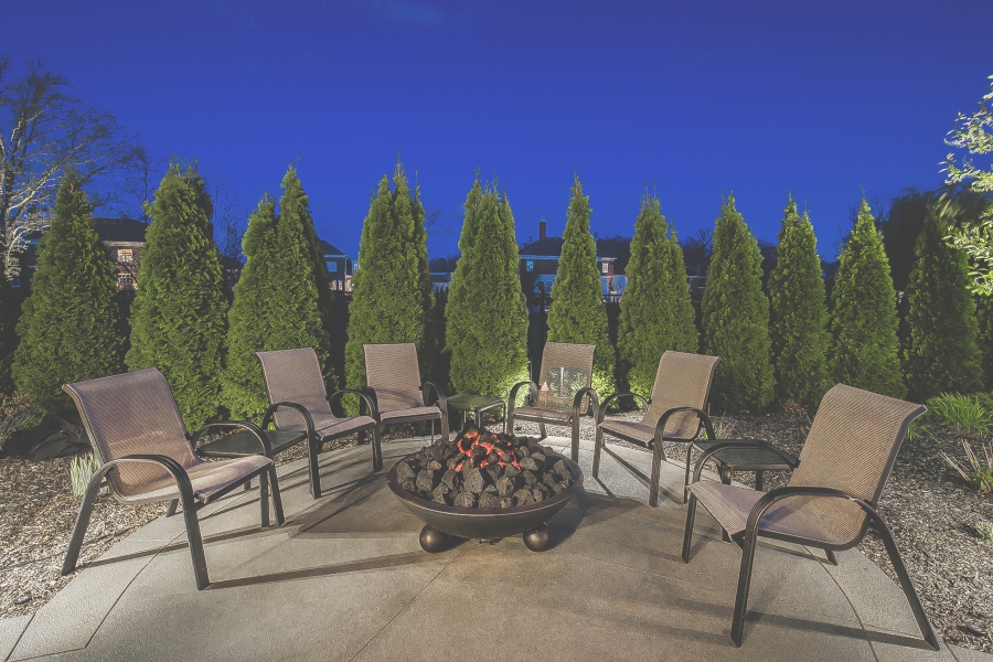 Image of six patio chairs around a fire pit 