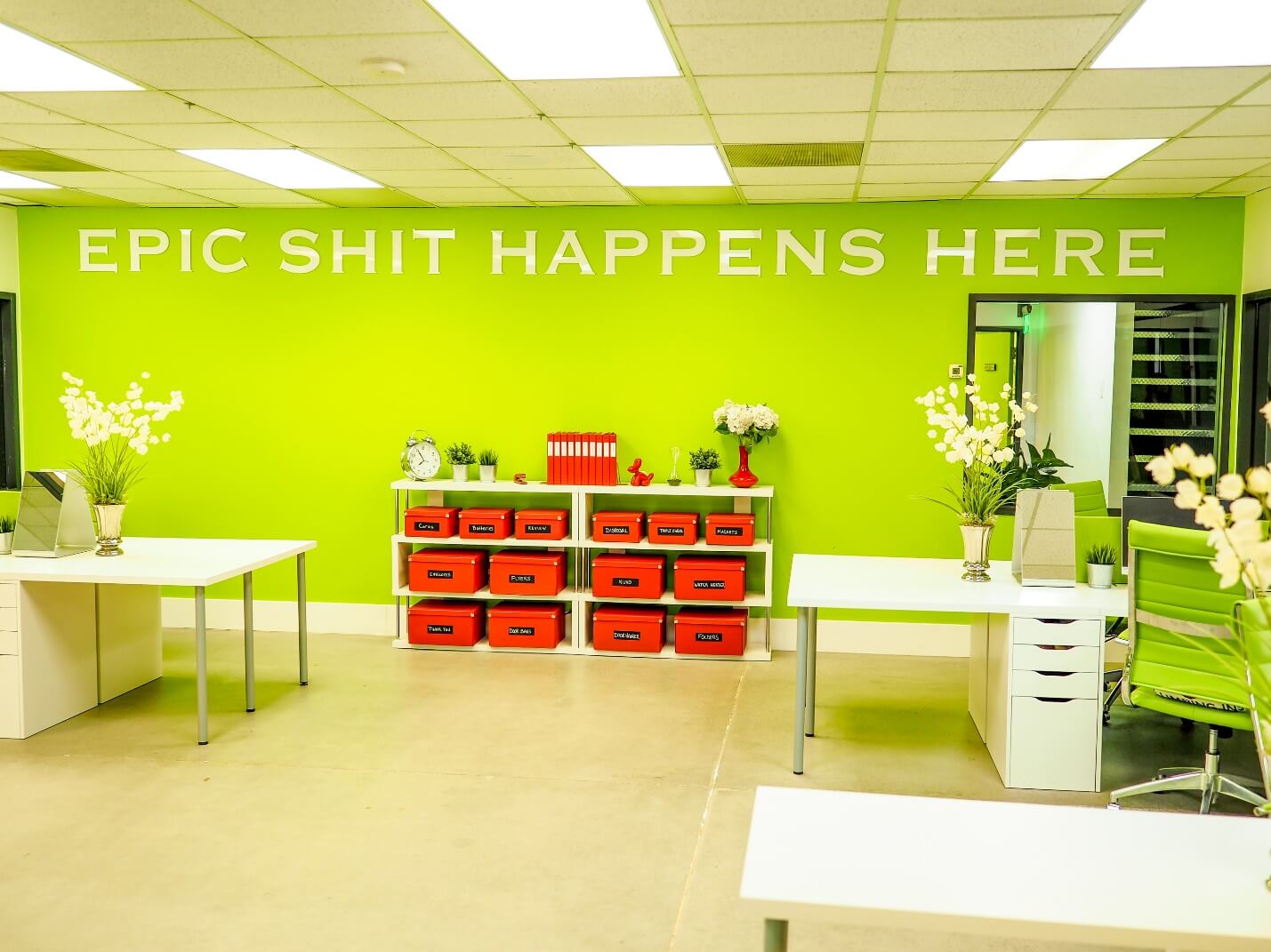 Image of dispatch office with the saying "epic shit happens here" shown on wall